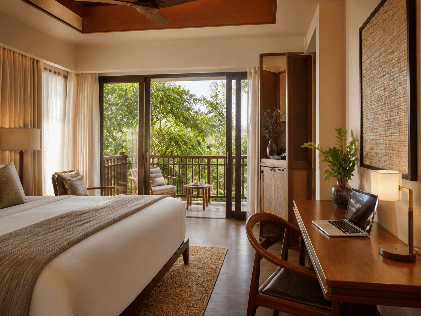 Resort suite workspace with a laptop