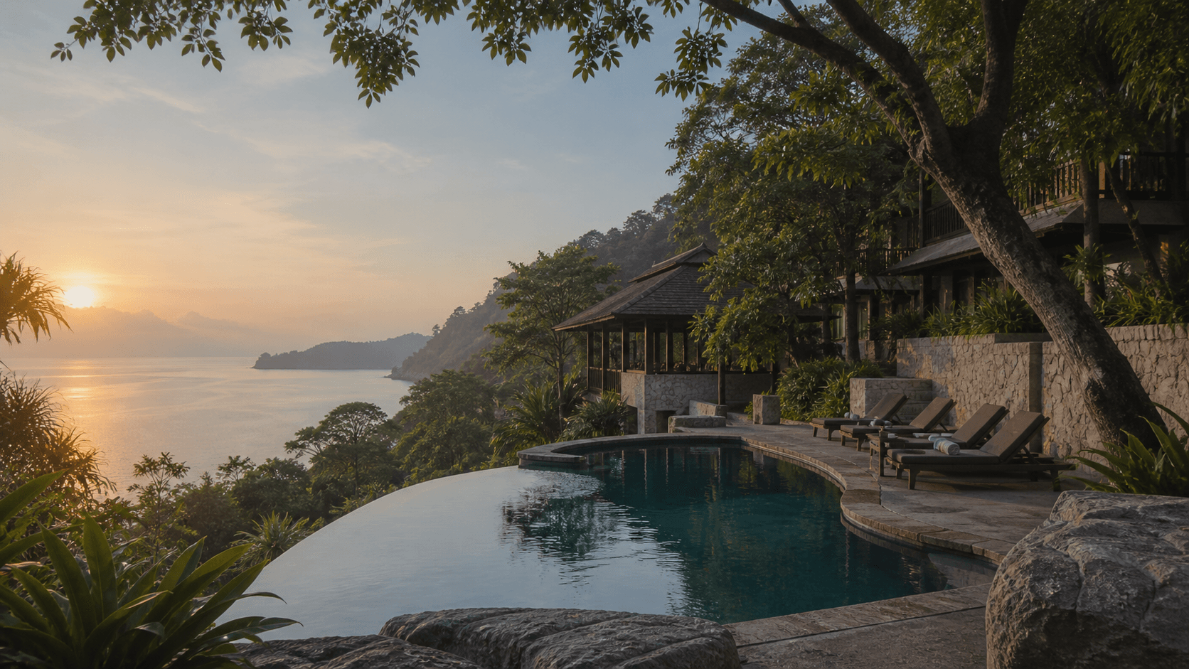 Private resort pool above the Langkawi coast at sunrise